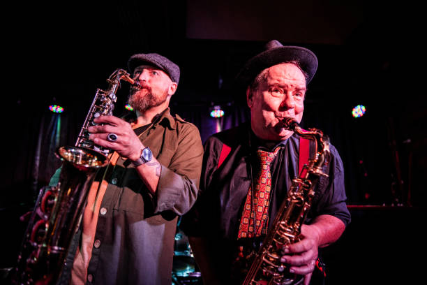 istock Musicians playing saxophone at nightclub 2159708259