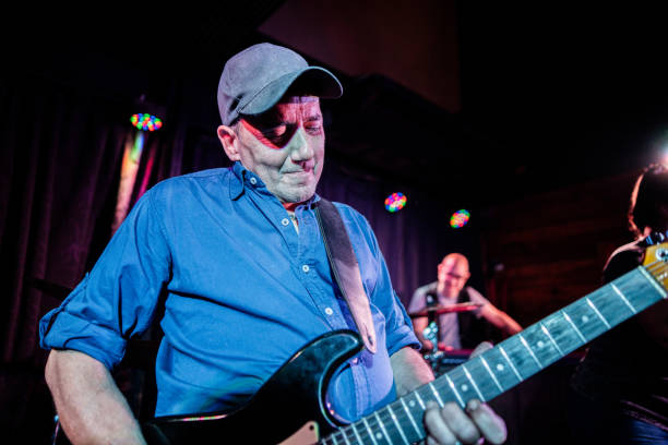 istock Mature man singing during show at night club 2159708414
