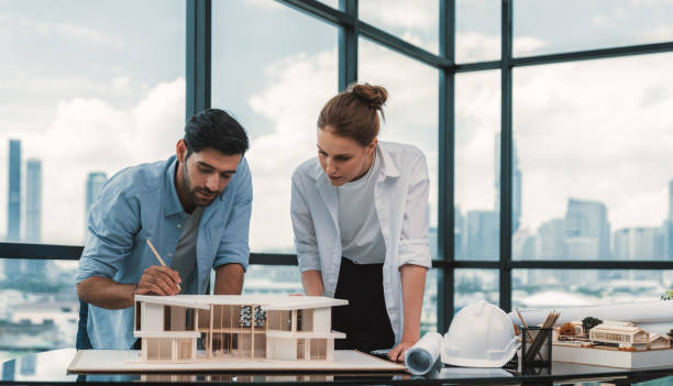 istock Smart architect engineer team working together to measure house model. Tracery. 2159709150