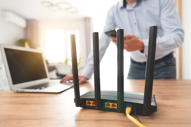 istock Modern wi-fi router on light table in room 2159709245
