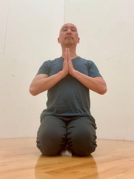 istock Filipino guy doing yoga meditation 2159710012