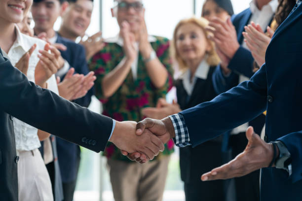 istock Cropped image of smart businessmen shaking hand, making agreement. Intellectual. 2159710833