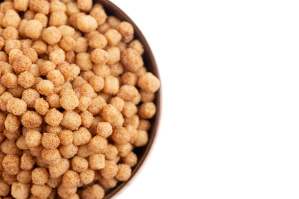 istock Small Ball Cinnamon Toast Flavored Breakfast Cereal Isolated on a White Background 2159712325