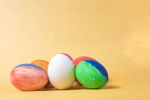 istock Colorful painted easter eggs on a yellow background with copy space. 2159712611