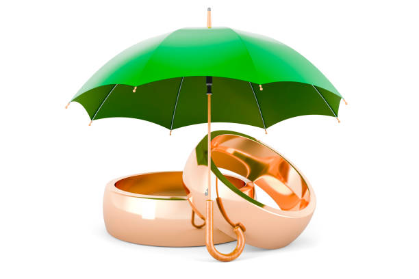 istock Golden wedding rings under umbrella. 3D rendering 2159715242