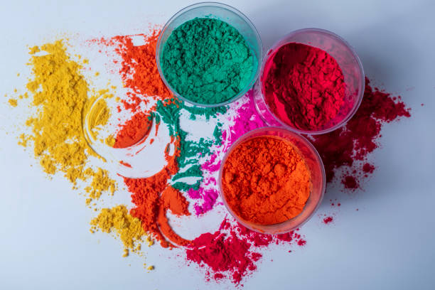 istock Colorful holi powder in plastic containers on a white background. 2159715291