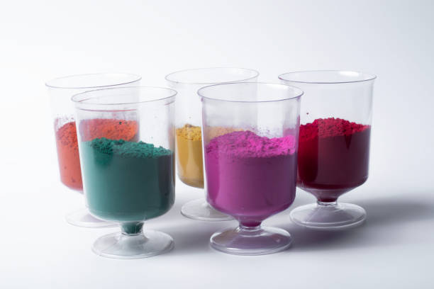 istock Multicolored holi powder in glass cups on white background. 2159715350