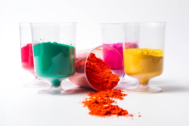 istock Colorful holi powder in measuring cups on a white background 2159715384