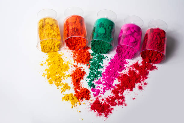 istock Colorful holi powder in a plastic containers on white background. Top view 2159715480