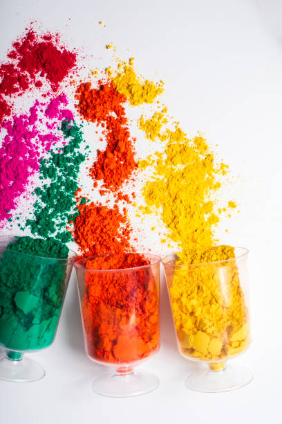 istock Colorful holi powder in plastic containers on a white background. 2159715501