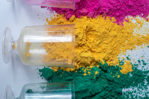 istock Multicolored holi powder in glass jars on white background. 2159716542