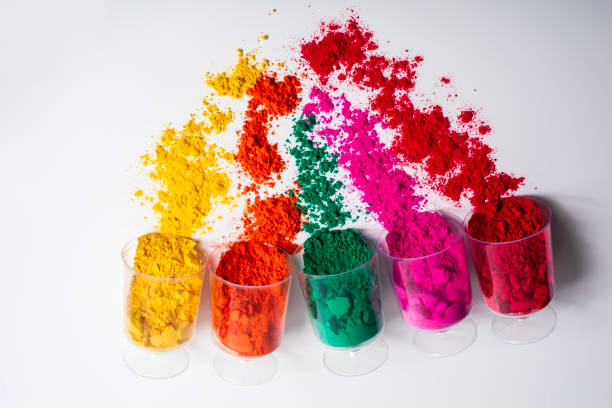 istock Colorful holi powder in a plastic containers on white background. 2159716637
