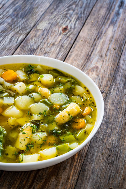 istock Asparagus soup on wooden table 2159718084