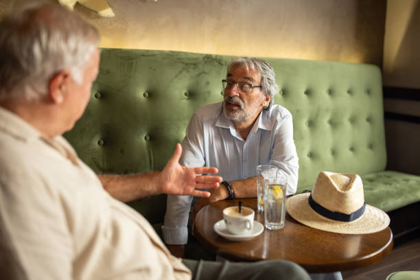 istock Elderly men sitting in cafe 2159718118