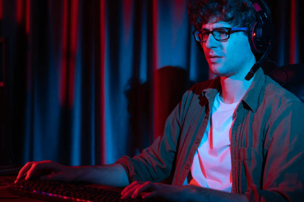 istock Streamer concentrated with Esport team on computer with harder game. Gusher. 2159720888