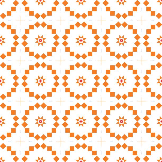 An abstract geometric pattern with orange and white shapes creating a repetitive design