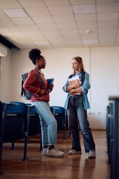 istock Female college friends communicating in the classroom. 2159721137