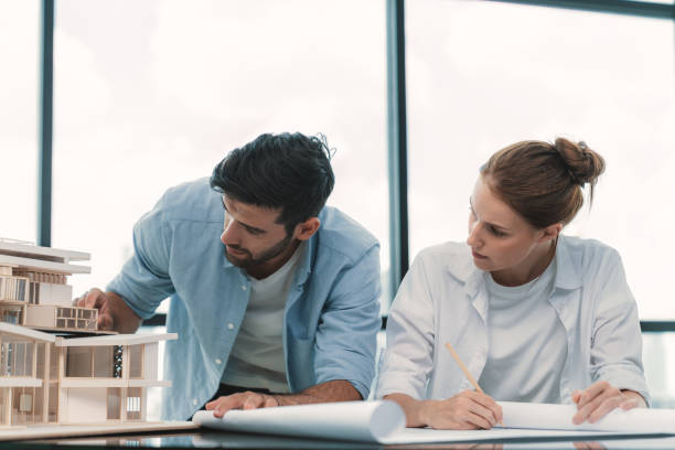 istock Professional architect team working together to design house model. Tracery. 2159722261