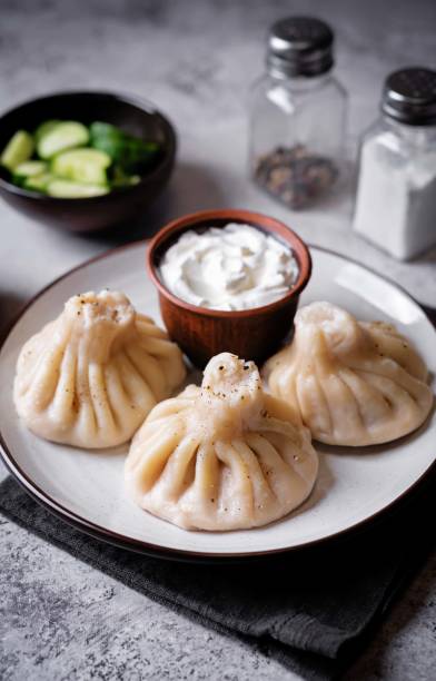 istock Khinkali with cream sauce in a plate 2159725558