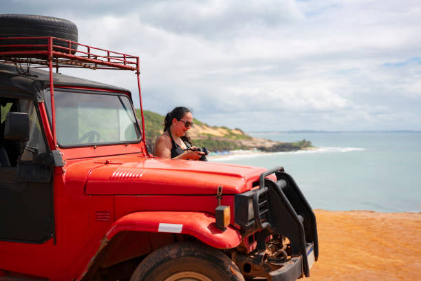 istock Tourists in buggy on the beach 2159728353