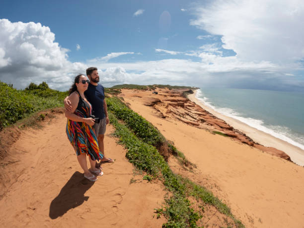 istock United couple looking at the beach 2159728438