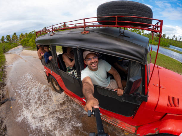old 4x4 car with Tourists in the Amboseli National Park in Kenya, Africa.