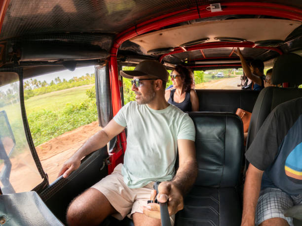 istock Man taking selfie in tourist car 2159728479