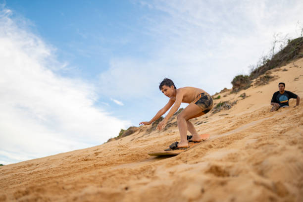 istock Boy playing sport on the sand 2159729581