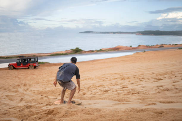 istock Man surfing in the sand 2159729583