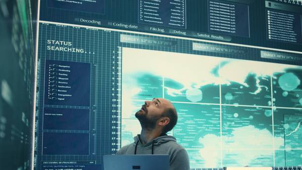 istock Governmental hacker examines info on a big screen in agency office 2159731054