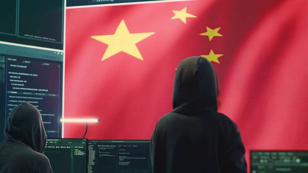 istock Governmental hacker in high tech office with Chinese flag shown on big screen 2159731143