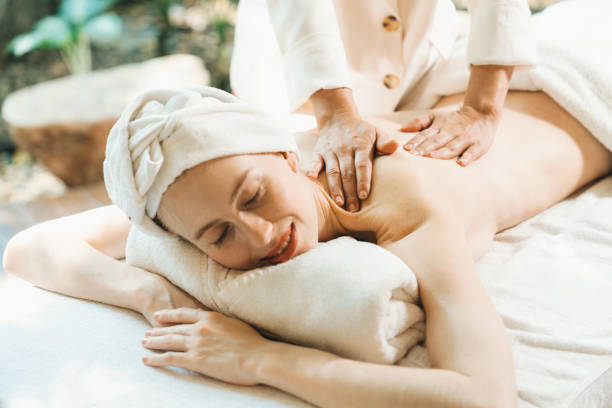 istock Beautiful young woman received a back massage on a spa bed. Tranquility. 2159732962