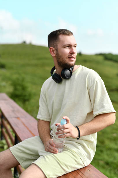 istock Male Looking At Horizon After Jogging And Drinking Water 2159735404