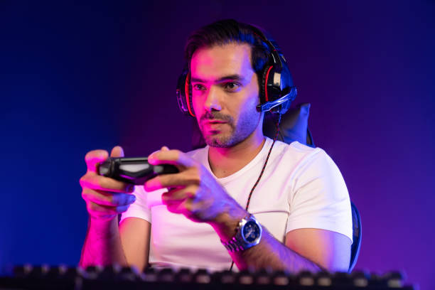 istock Gaming streamer concentrating gaming players with joystick control. Surmise. 2159737336