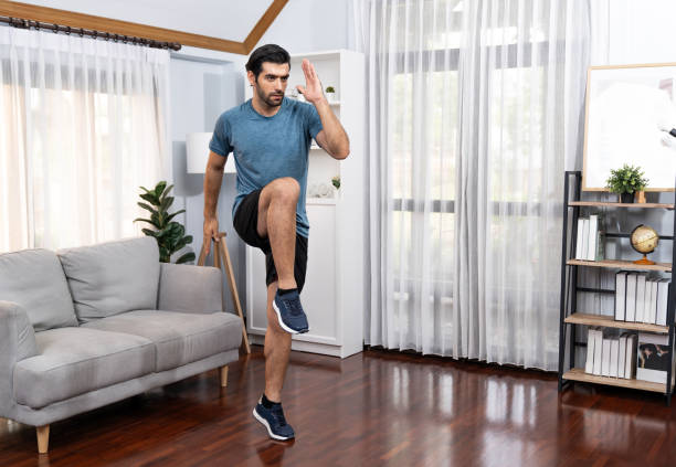 istock Athletic and sporty man running posture exercise at gaiety home. 2159737361
