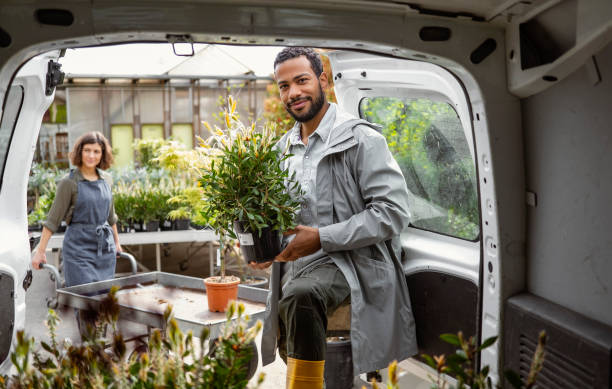 istock Diverse Gardeners Preparing Plants for Delivery 2159740125