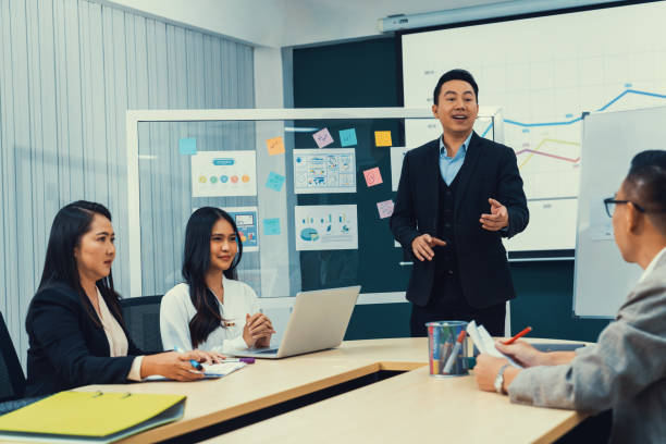 istock Businessmen present financial project for managers' approval. Intellectual. 2159742183