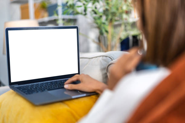 Human working with modern laptop computer blank white desktop screen for advertising, mockup, technology, advertising, search information, creative design on table