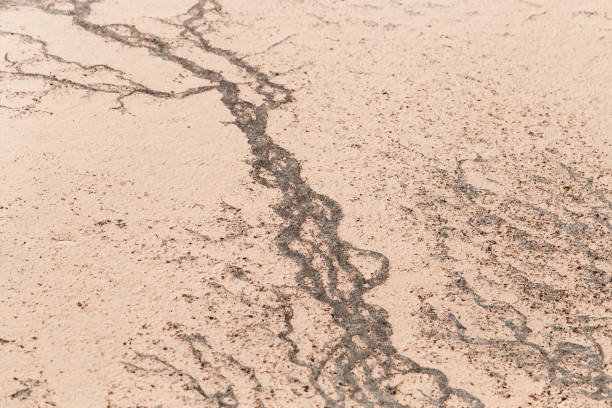 Abstract relief rough gritty neutral beige surface of background texture. Aesthetic pattern on sandstone. Top view textured sand, natural ornament or wallpaper, macro photo shore salt lake