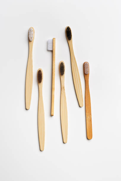 istock Assorted bamboo toothbrushes on white background, eco-friendly oral hygiene, tooth care, personal toothbrush for everyday use. Minimal aesthetic flat lay, top view Zero waste, organic product 2159747295