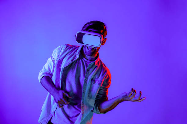 istock Caucasian man moving playing guitar gesture while wearing VR glass. Deviation. 2159747338