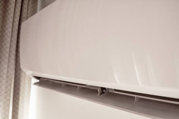 Home conditioner high on the wall cooling the room in the interior