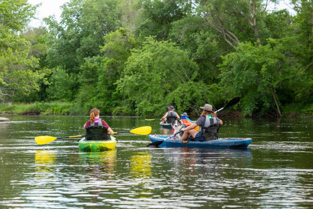 istock Family Kayaking on River on Summer Evening 2159752041