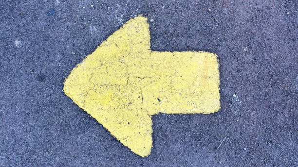 istock yellow arrow on the asphalt 2159756174