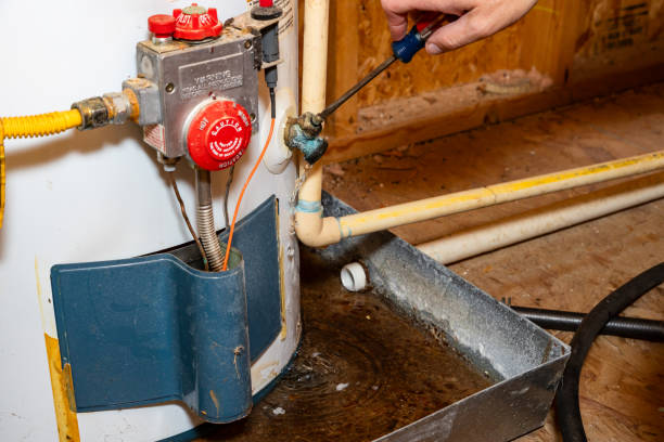 istock Screwdriver closing drain valve on water heater 2159757425