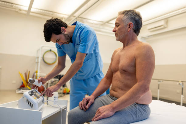 istock Physical therapist getting ready to apply ultrasound therapy on a patient 2159758061