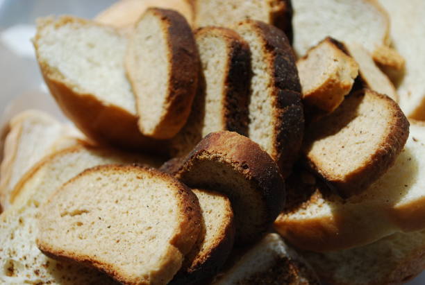 istock Dry hard bread chucks crackers and white bread close up 2159759329
