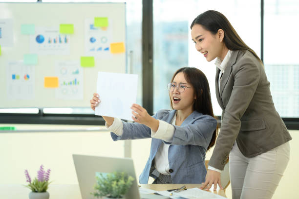 istock Two adult business colleagues collaborating on data analysis in a modern co working space 2159759361