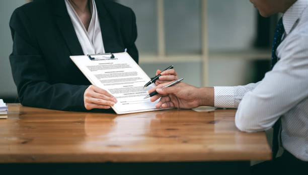 istock Businesswoman with client  signing contract in office 2159760815