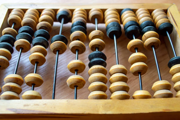 istock Wooden hand abacus lies on a wooden surface 2159762472